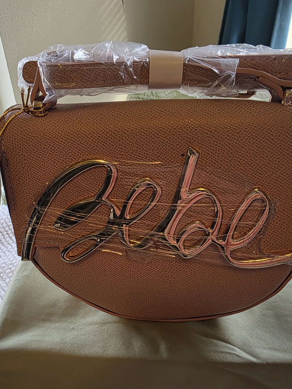 bebe Mauve Textured Crossbody with Gold Script Logo